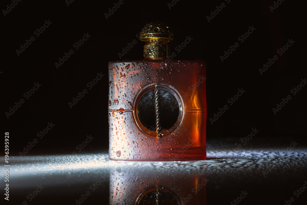 Perfume bottle on dark background