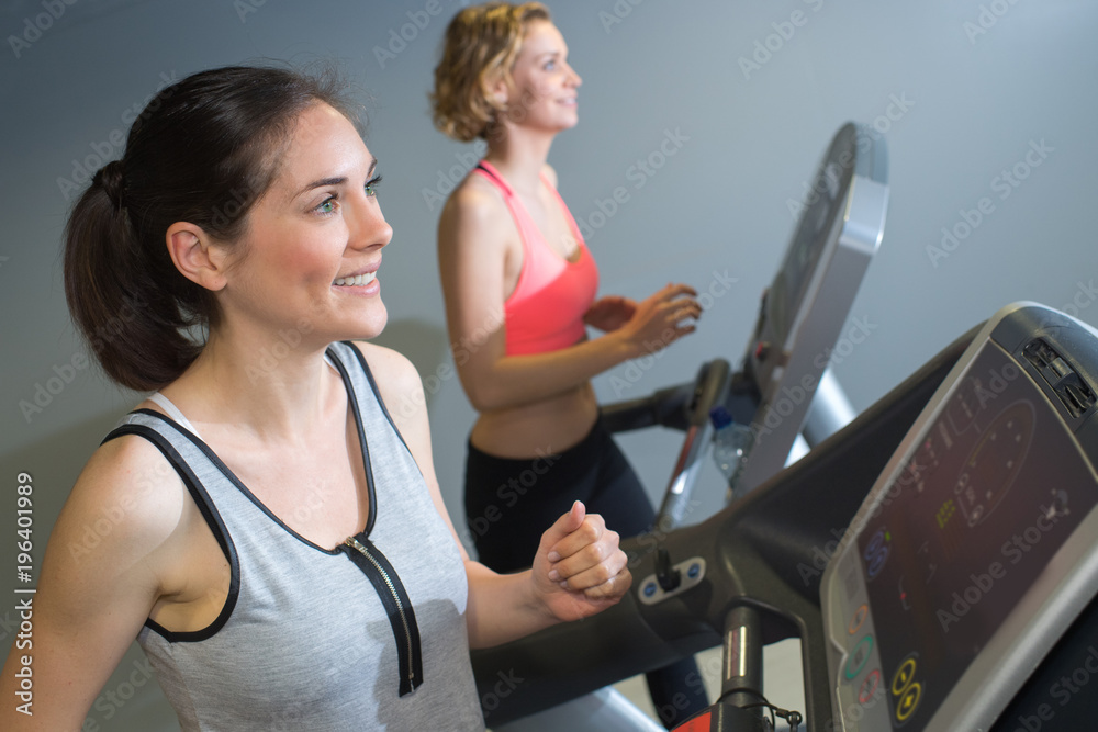 Fototapeta premium two women training in a gym