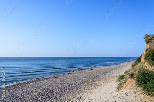 Urban landscape of the Black Sea coast  on which people are resting