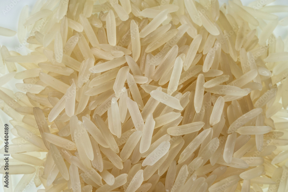 Grains of jasmine rice close-up. One of the varieties of rice. Selective focus. Grains of jasmine rice close-up. One of the varieties of rice. Selective focus.