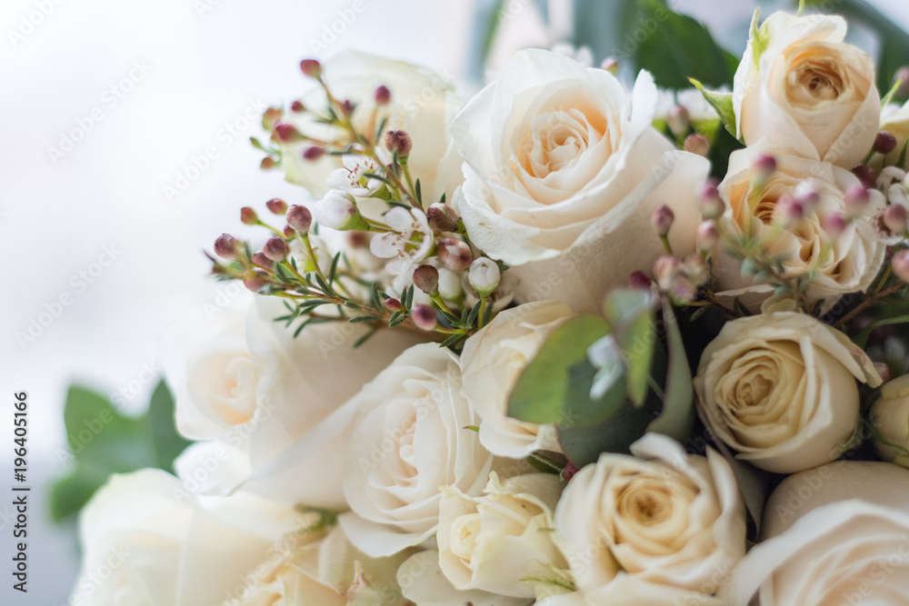 Tender beautiful wedding bouquet closeup,  peach color roses and decoration, selective focus