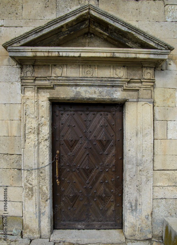 Ancient door in a castle. Old wooden door.