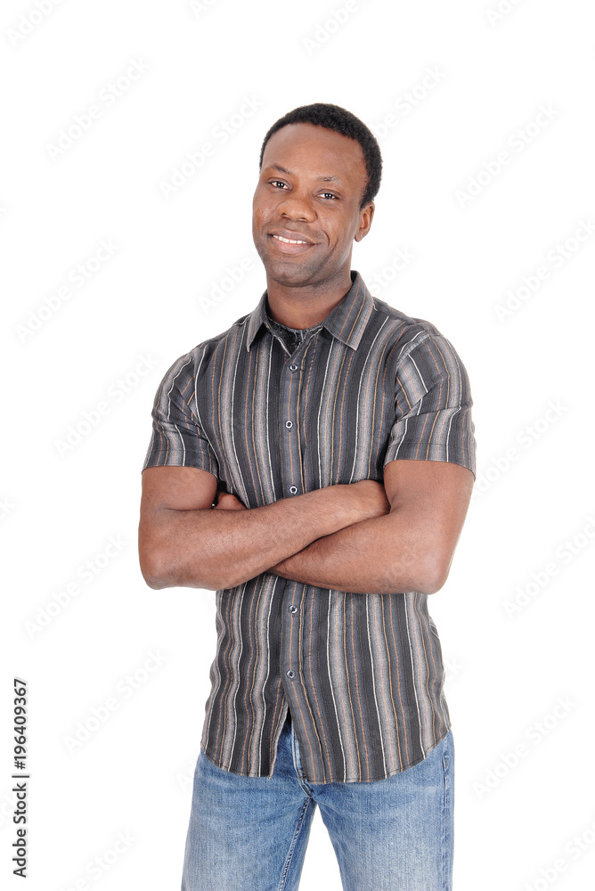 Fototapeta premium Handsome African man smiling arms crossed