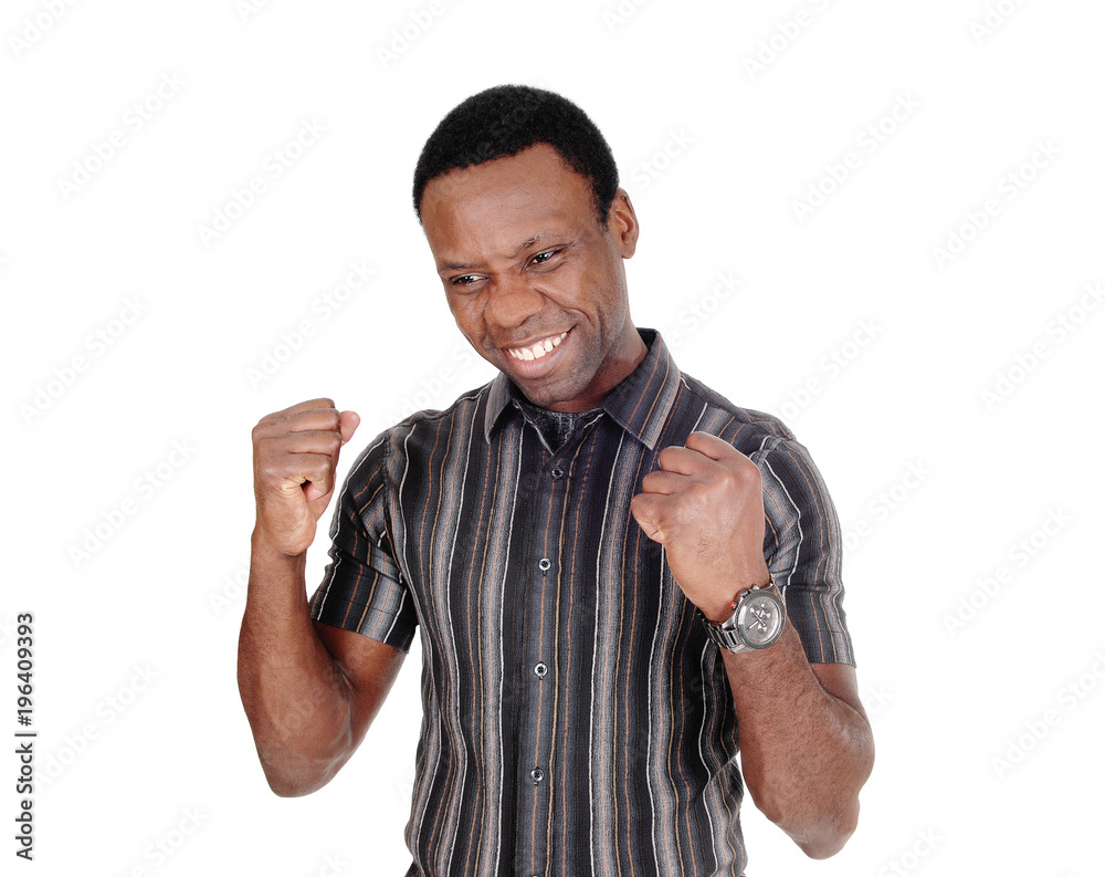 Fototapeta premium Young African man is happy over victory