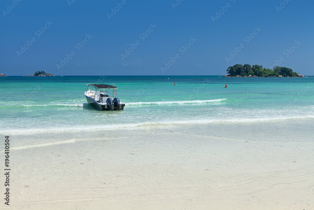 White coral sand on а tropical beach. Praslin island, Seychelles