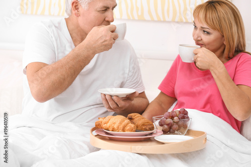 Mature couple having breakf...