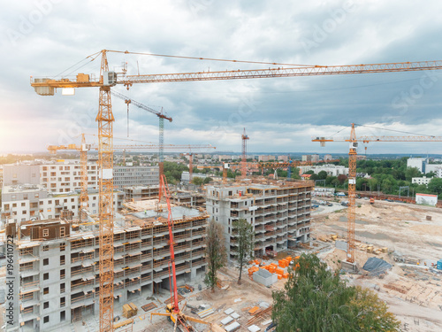Aerial view of construction site with crane and building. Top view of big development construction and architecture.