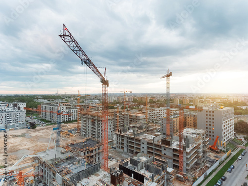Aerial view of construction site with crane and building. Top view of big development construction and architecture.