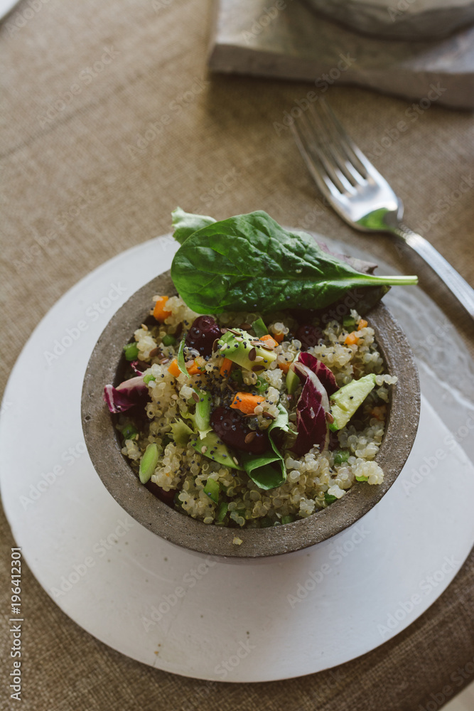 Salad of quinoa, red beans and vegetables, in the bowl, on the table ready to eat Salad of quinoa, red beans and vegetables, in the bowl, on the table ready to eat