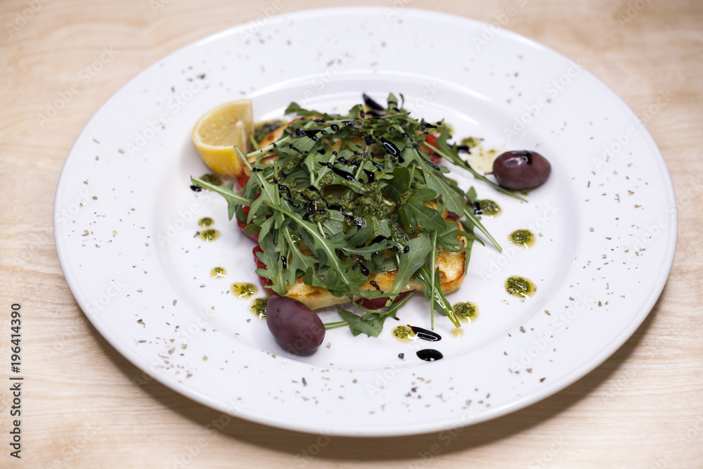 Salad with rucola grilled cheese and tomato Salad with rucola grilled cheese and tomato