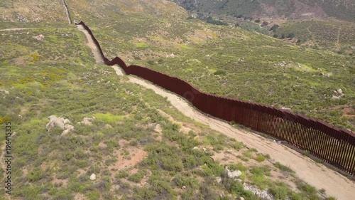 A low aerial along the U.S Mexican border wall fence. photo