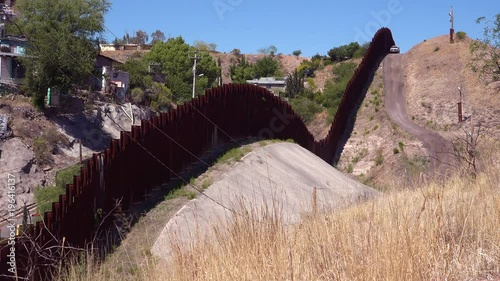 A view along the US Mexico border wall at Nogales, Arizona. photo