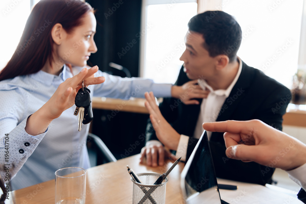Young couple solves issue of division of property in attorney's office for divorce. Young couple solves issue of division of property in attorney's office for divorce.