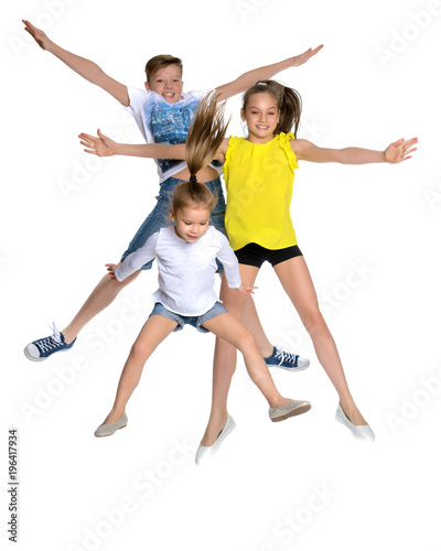 A group of children jumping and waving.