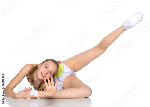 The gymnast perform an acrobatic element on the floor.