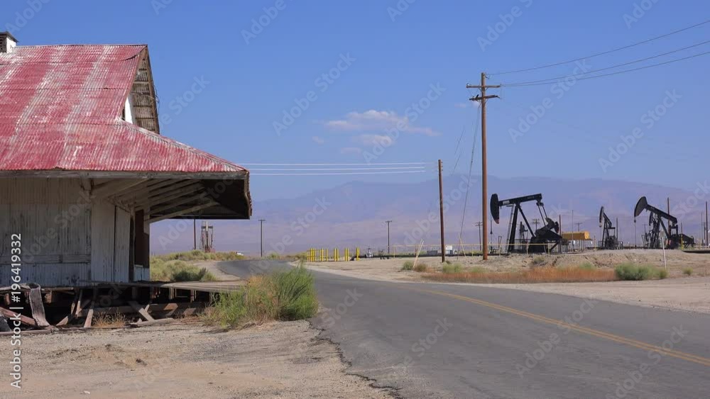 Oil fields and derricks near Bakersfield, California.