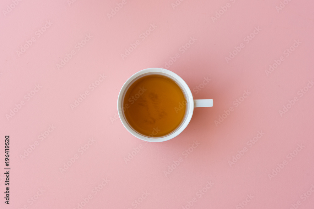 Directly above view of tea in cup on pink background - obrazy, fototapety, plakaty 