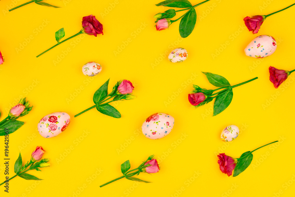 Happy Easter concept. Pattern colorful spring's flowers and colorful easter eggs on yellow background