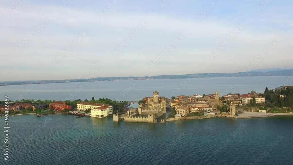 erial view. The Scaliger Castle in Sirmione. Lake Garda, Italy. 4K. erial view. The Scaliger Castle in Sirmione. Lake Garda, Italy. 4K.