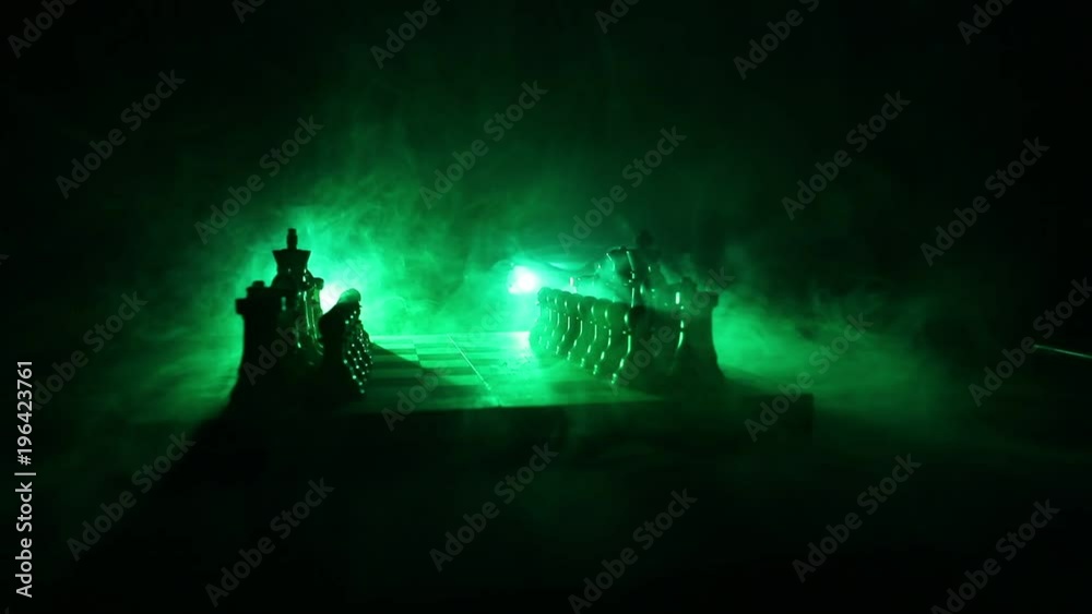 Slider shot. Chess board game concept of business ideas and competition and strategy ideas concept. Chess figures on a dark background with smoke and fog. Selective focus Slider shot. Chess board game concept of business ideas and competition and strategy ideas concept. Chess figures on a dark background with smoke and fog. Selective focus