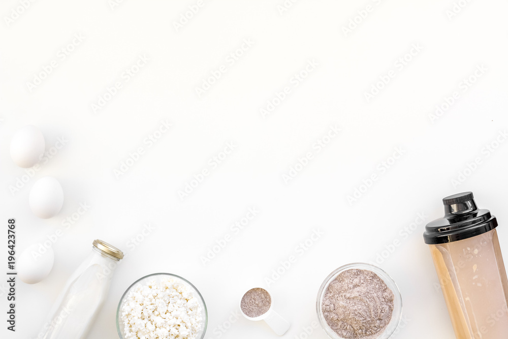 sport diet protein nutrition with eggs and milk and fitness equipment on white background top view mock up sport diet protein nutrition with eggs and milk and fitness equipment on white background top view mock up