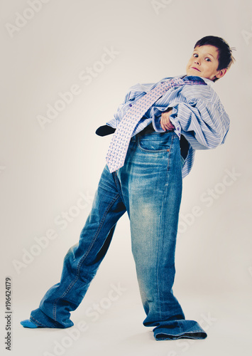 funny boy wearing Dad's clothes