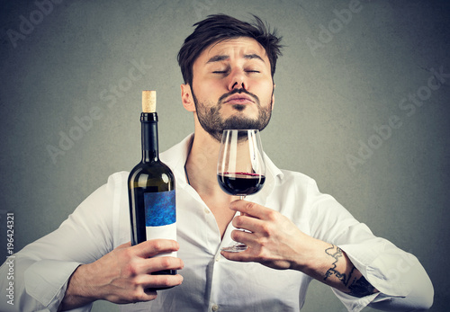 Sommelier smelling wine in glass