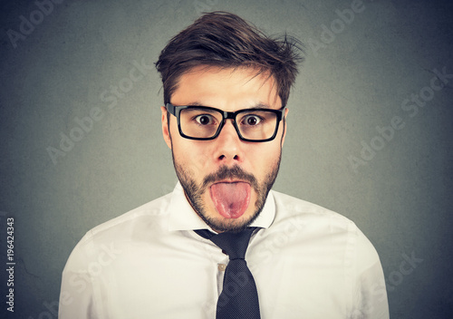 Photography portrait of a man showing his tongue