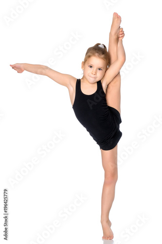 The gymnast balances on one leg. © lotosfoto