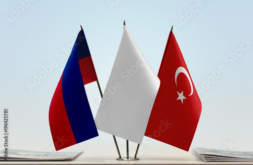 Flags of Liechtenstein and Turkey with a white flag in the middle