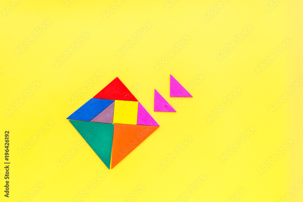 pieces of bright paper for puzzle on yellow office background top view mockup pieces of bright paper for puzzle on yellow office background top view mockup