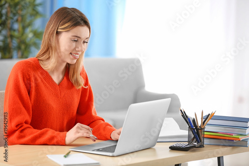Pretty student with laptop ...