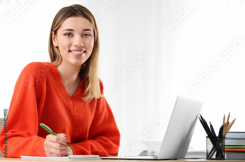 Pretty student with laptop ...