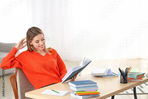 Pretty student studying at ...
