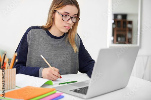 Pretty student with laptop ...