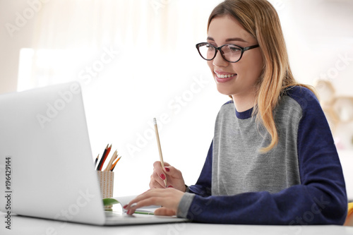 Pretty student with laptop ...