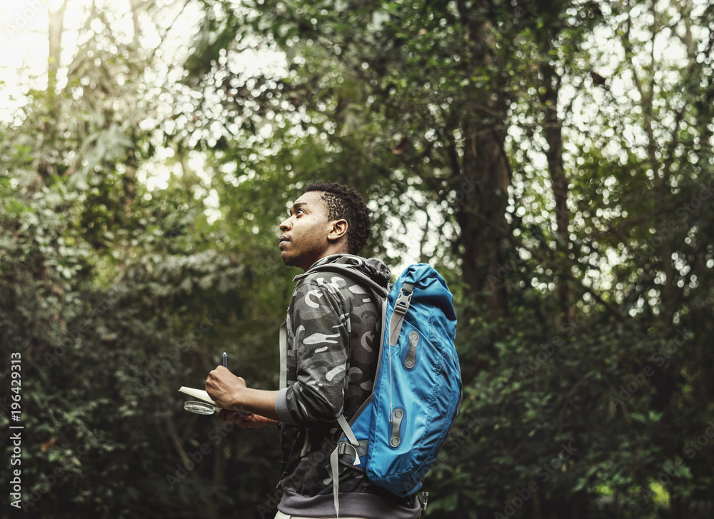 Biologist in a forest exploring