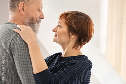 Wallpaper Mural Happy mature couple dancing at home Torontodigital.ca