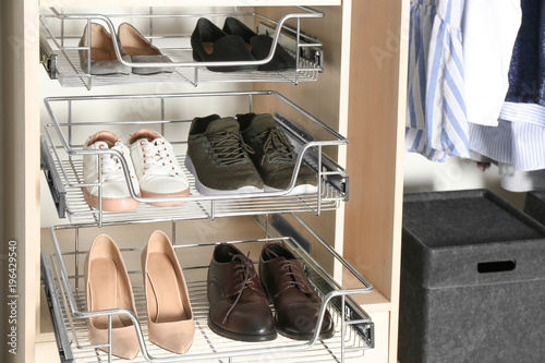 Different shoes on shelves ...