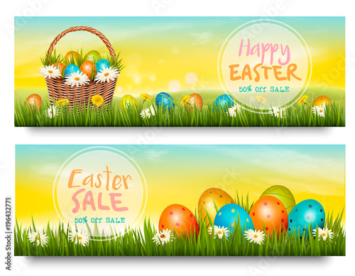 Two Easter Sale banners. Colorful eggs in green grass. Vector.
