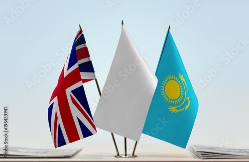 Flags of Great Britain and Kazakhstan with a white flag in the middle