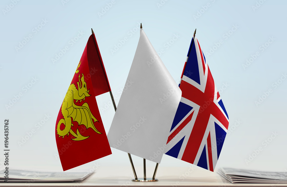 Flags of Wessex and Great Britain with a white flag in the middle