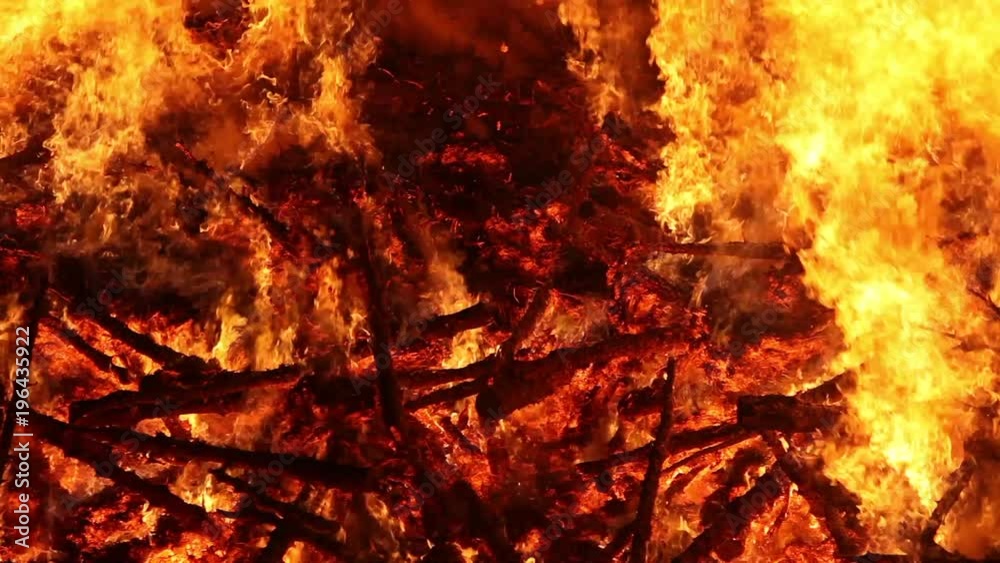 Close up of a huge bonfire raging at night. Close up of a huge bonfire raging at night.