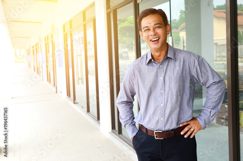 Cheerful asian businessman