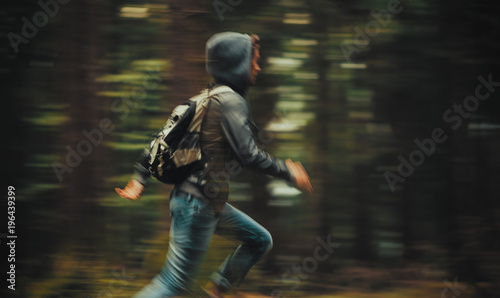 Man running in the forest photo