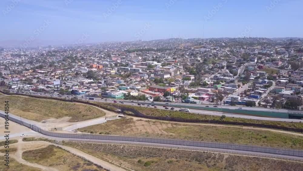 High aerial over the border wall fence separating the US from Mexico and San Diego from Tijuana. High aerial over the border wall fence separating the US from Mexico and San Diego from Tijuana.