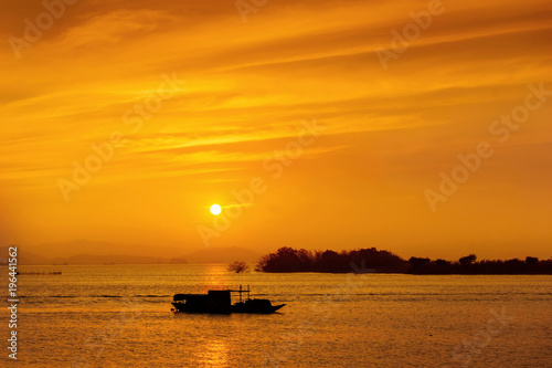 Fishing boat silhouette at sea