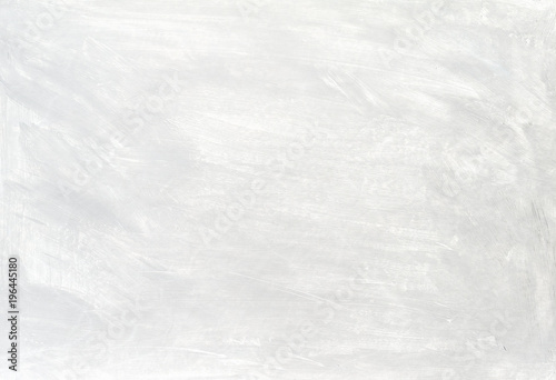 White washed painted textured abstract background with brush strokes in gray and black shades.