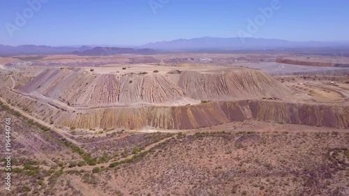 An aerial over a vast open pit strip mine in the Arizona desert. photo