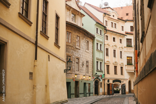 A beautiful street with traditional houses in Prague in the Czech Republic.